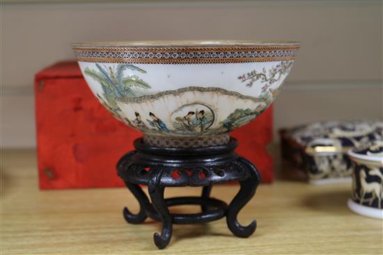 A Chinese egg shell porcelain bowl, wood stand and box